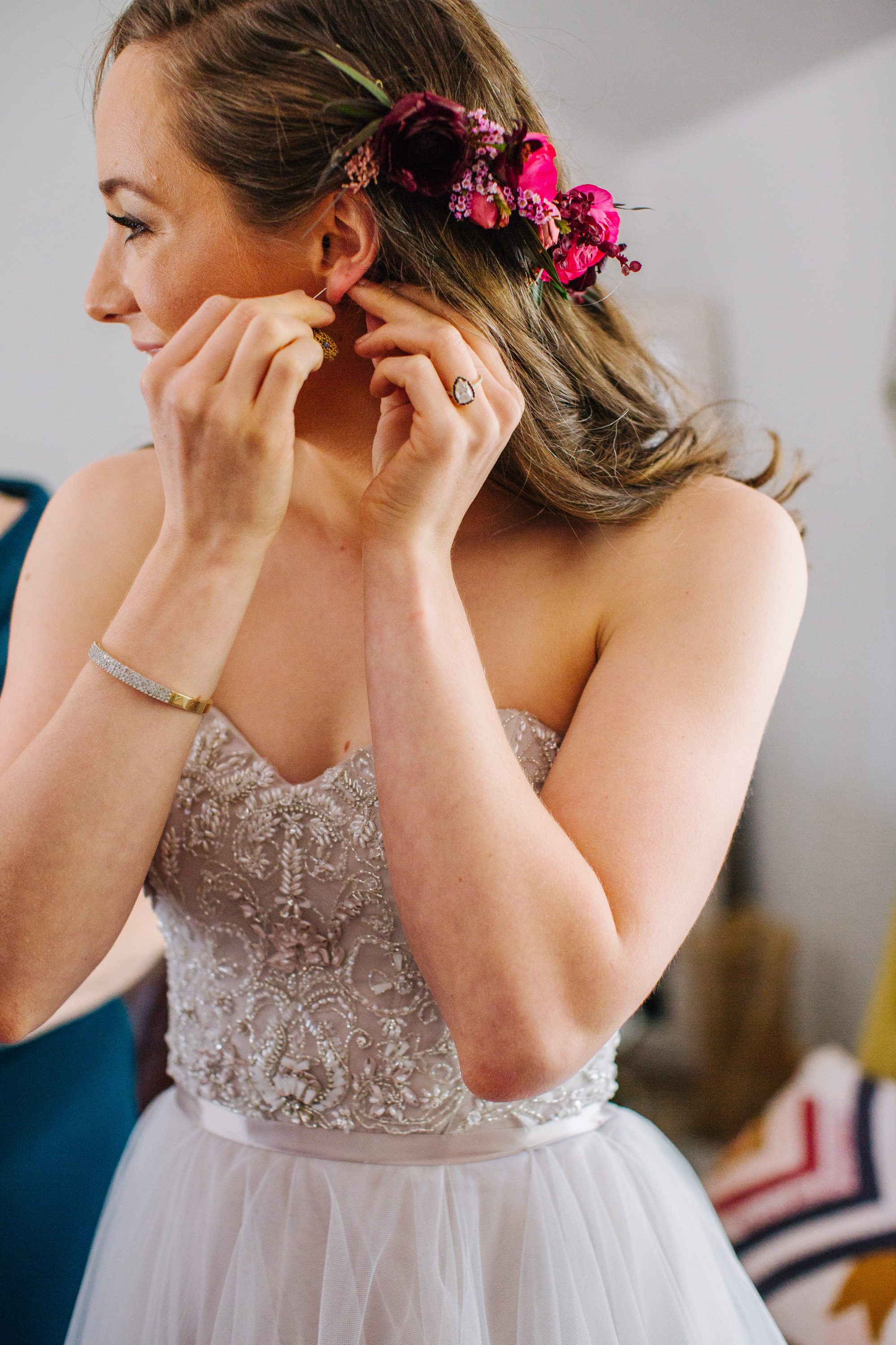 bride getting ready, bride with flowers in hair, wedding hair with flowers, beaded wedding dress, strapless wedding dress