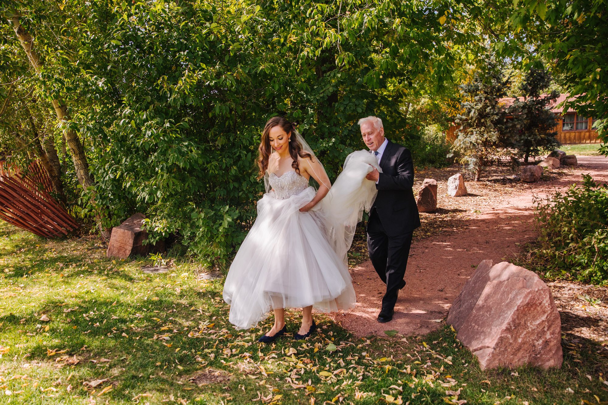 planet bluegrass wedding, lyons wedding venue, outdoor wedding venue in colorado, summer wedding, colorado wedding venue, bride with dad, bride and father, daddy daughter moment, dad and daughter wedding, tule wedding dress, strapless wedding dress, beaded top wedding dress