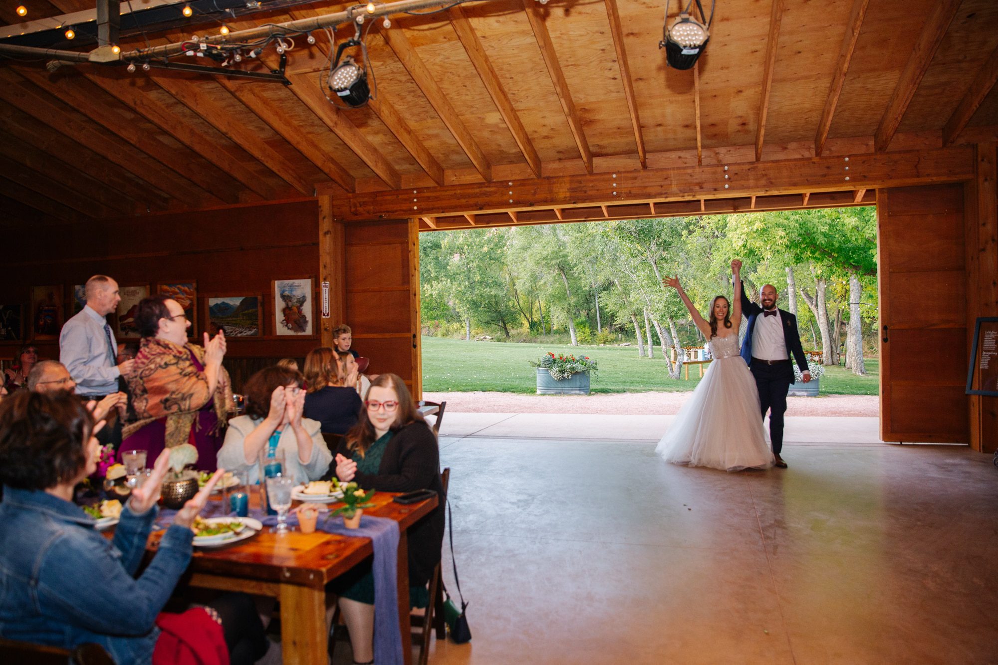 bride and groom announcement, bride and groom entering wedding reception, planet bluegrass wedding reception, indoor barn wedding, colorado wedding venues, indoor wedding venues in colorado
