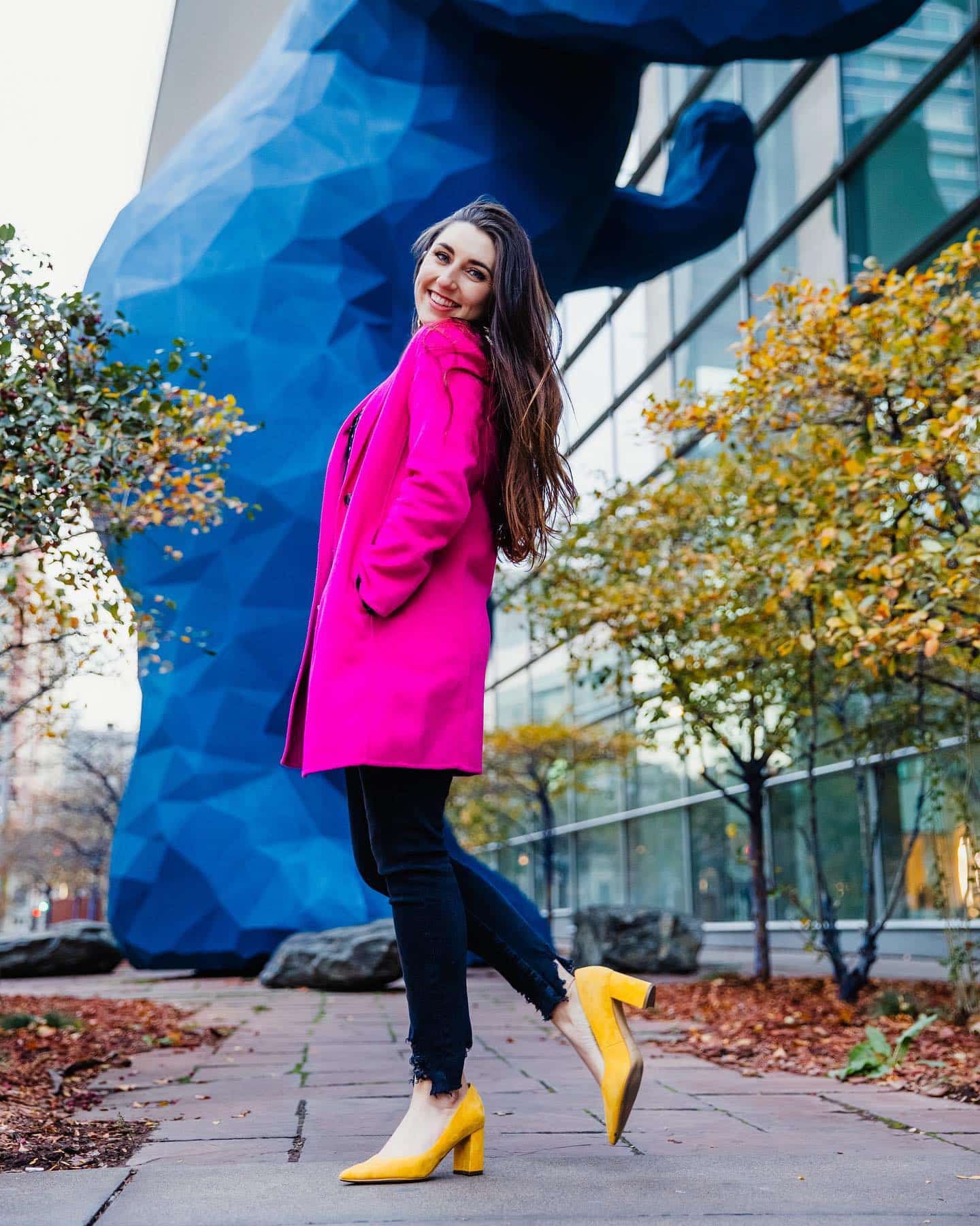 Denver wedding photographer in front of big blue bear