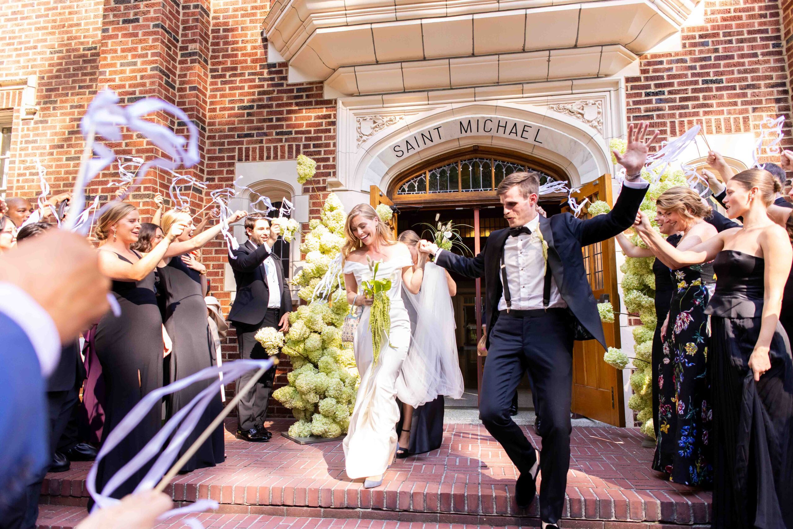 Bride and groom leaving their church wedding in downtown Seattle, shot by Seattle wedding photographer Erin Witt.