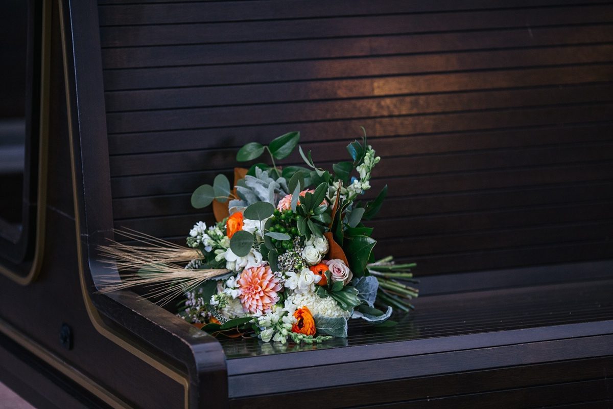 wedding flowers, earthy wedding florals, pops of orange wedding bouquet, union station denver