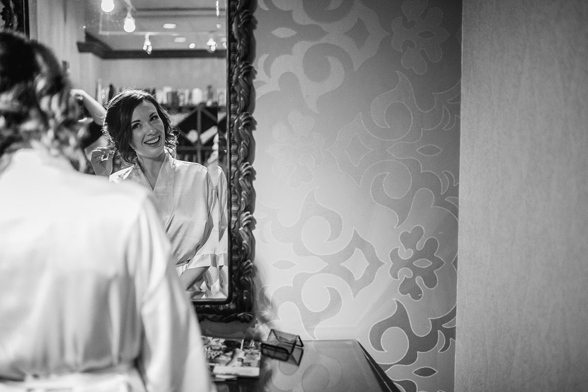 bride getting ready, black and white photos, bride in black and white, bridal in robe, bridal hair, finishing touches bride