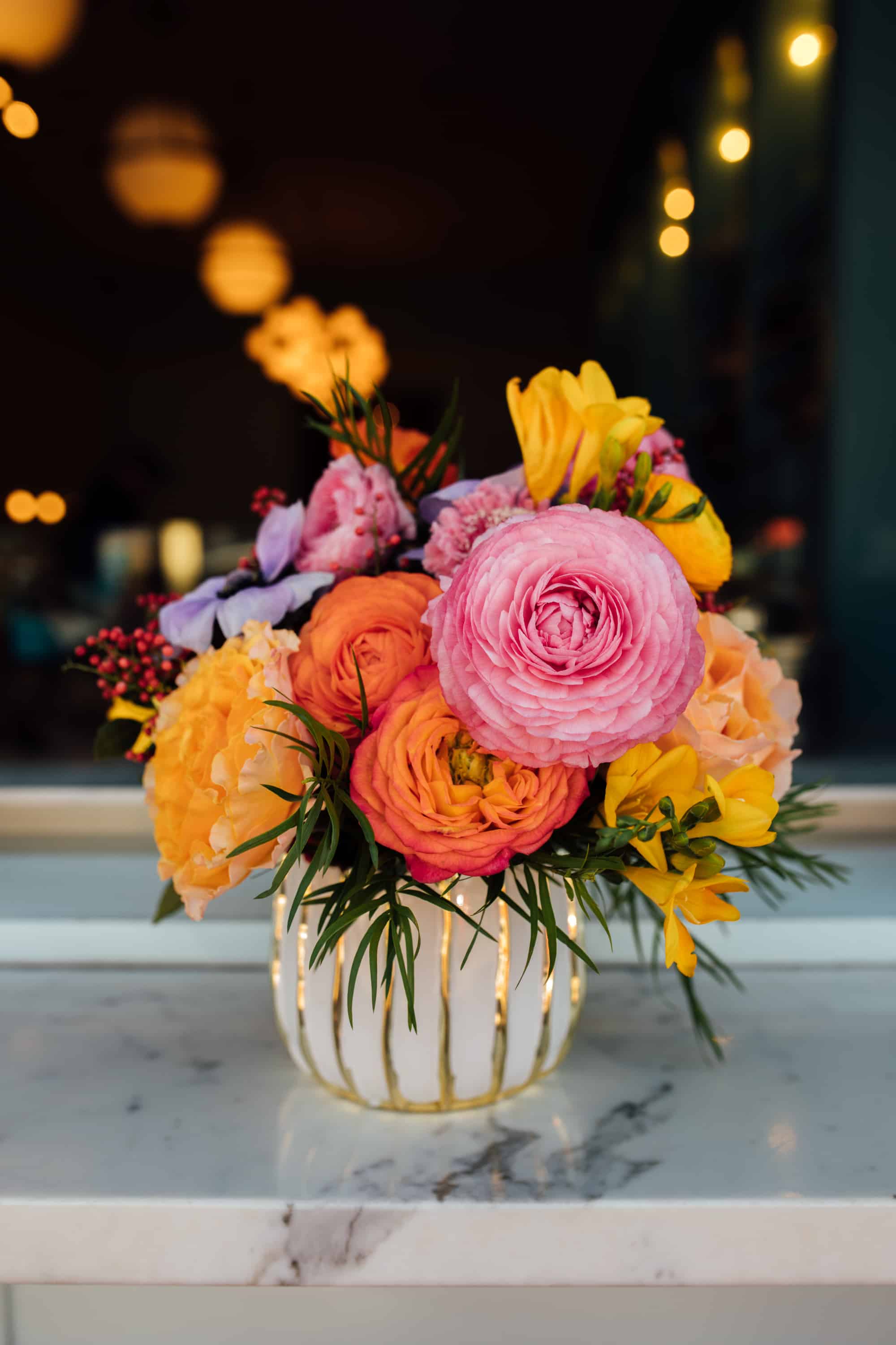 colorful wedding flowers, pink orange and yellow wedding colors, white and gold vase, art deco vase, fluffy flowers, warm color flowers, denver wedding photographer