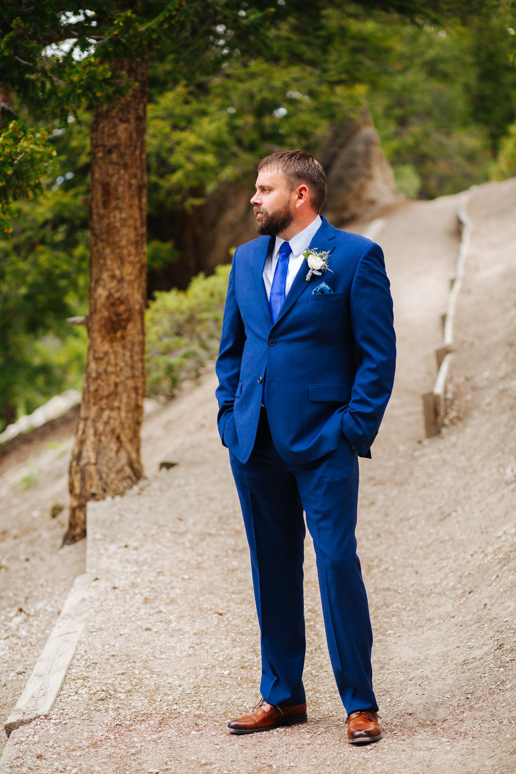 sapphire point, sapphire point wedding, blue suit groom, blue pocket square, colorful wedding photographer, colorful colorado wedding, intimate wedding, intimate wedding photographer, groom details, white groom flowers, groom portraits, blue suits