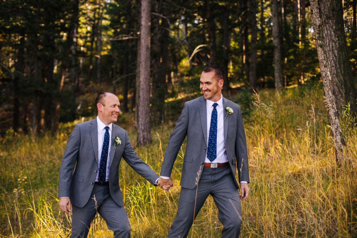 the pines at Genesee, the pines at Genesee venue, lgbt, two grooms, lgbtq, lgbt photographer, denver lgbt photographer, denver photographer, best photographers in denver, lgbt engagement photographer, denver lgbt engagement photographer, lgbt vendors, denver gay marriage, first look, two grooms walking through field