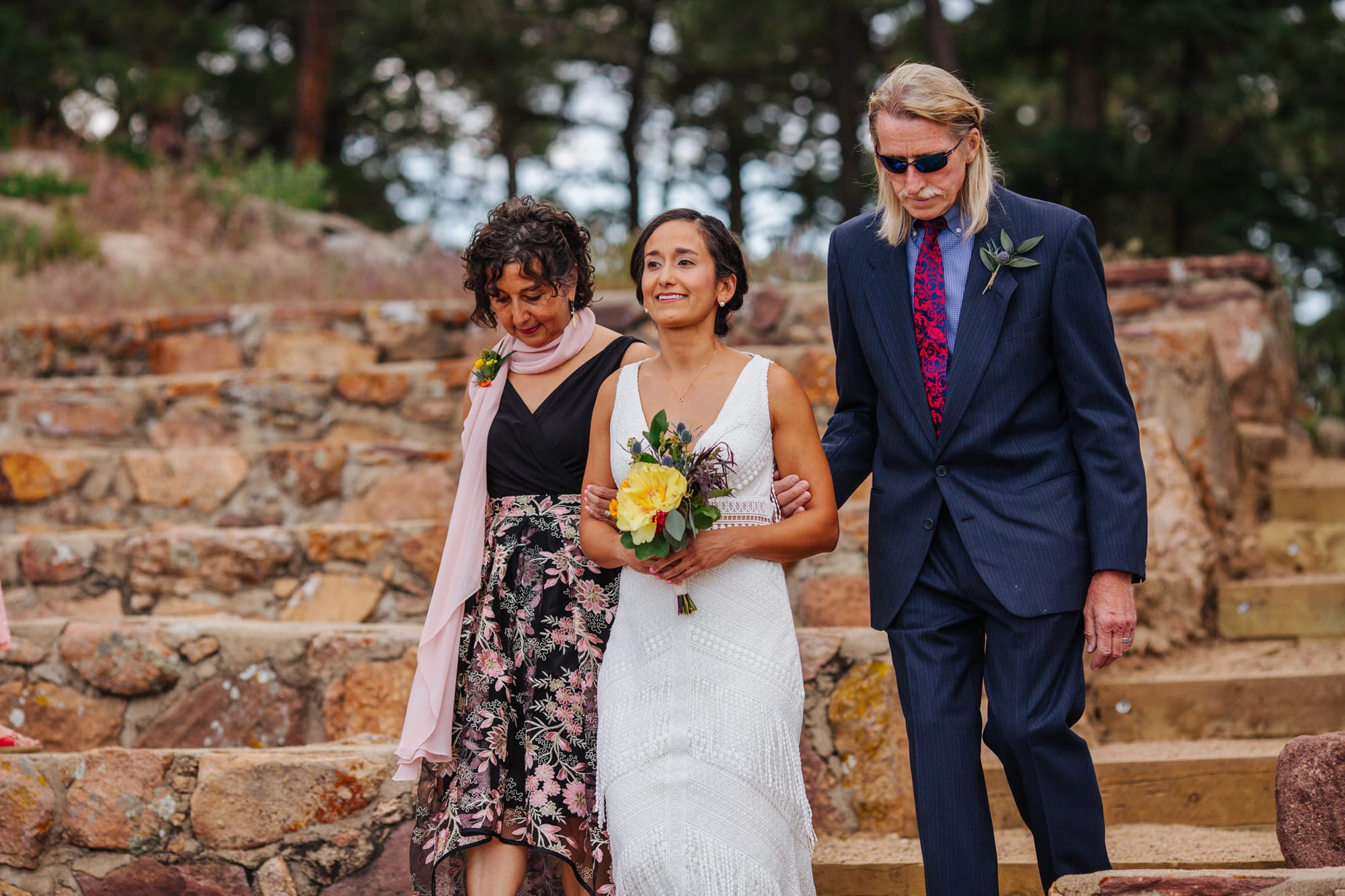 bride with parents, bride and mom and dad, bride with dad, walking down aisle, minimal wedding flowers, yellow wedding flowers
