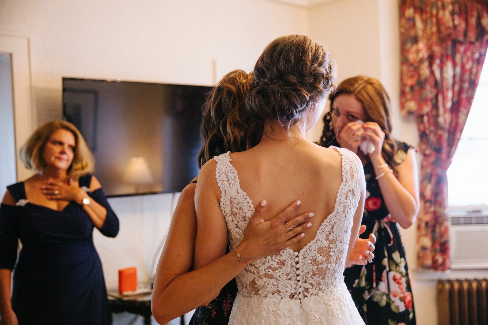 bride with family, bride getting ready with family, emotional family during wedding