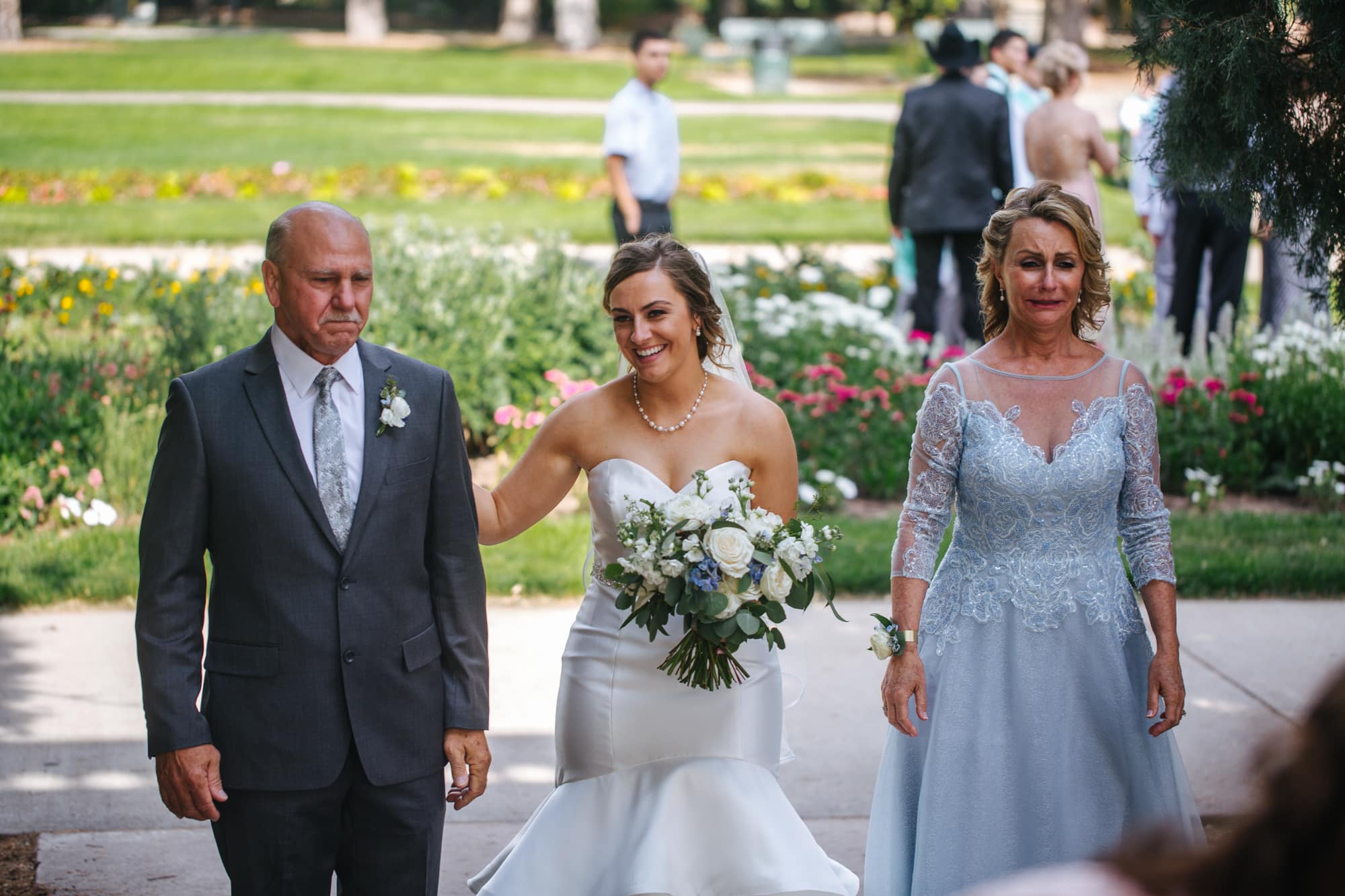 bride with parents, bride with dad before walking down aisle, dad crying with bride, mom crying with bride, bride with parents on wedding day, Cheeseman Park wedding, outdoor wedding ceremony, white wedding flowers, light blue mother of bride dress