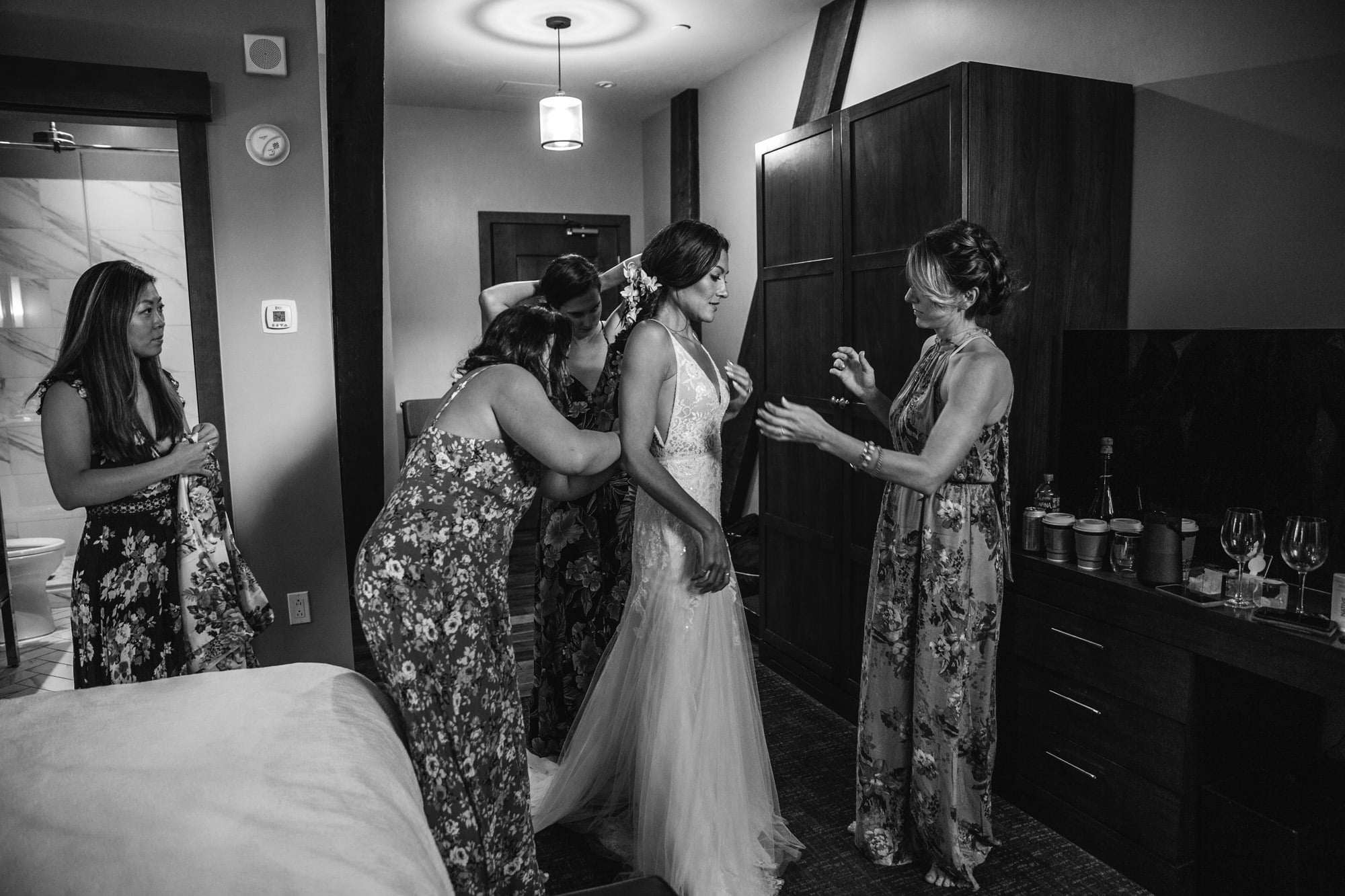 bridesmaids getting ready, bridesmaids floral dresses, flower bridesmaid dresses, bride getting ready, the Crawford hotel, union station wedding denver, bride getting into dress