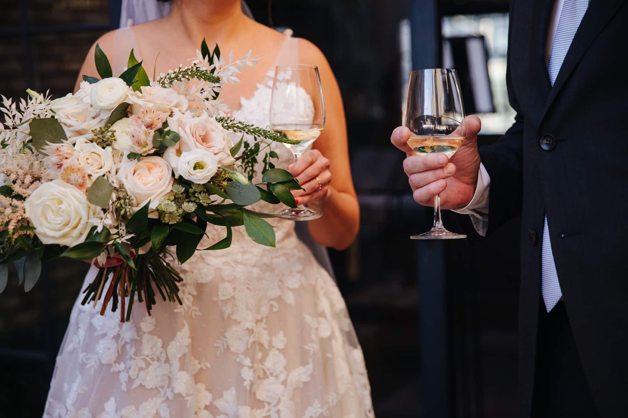 bride and groom cocktail hour, bride and groom with drinks, bride and groom at bar, cocktail hour at wedding, wedding reception