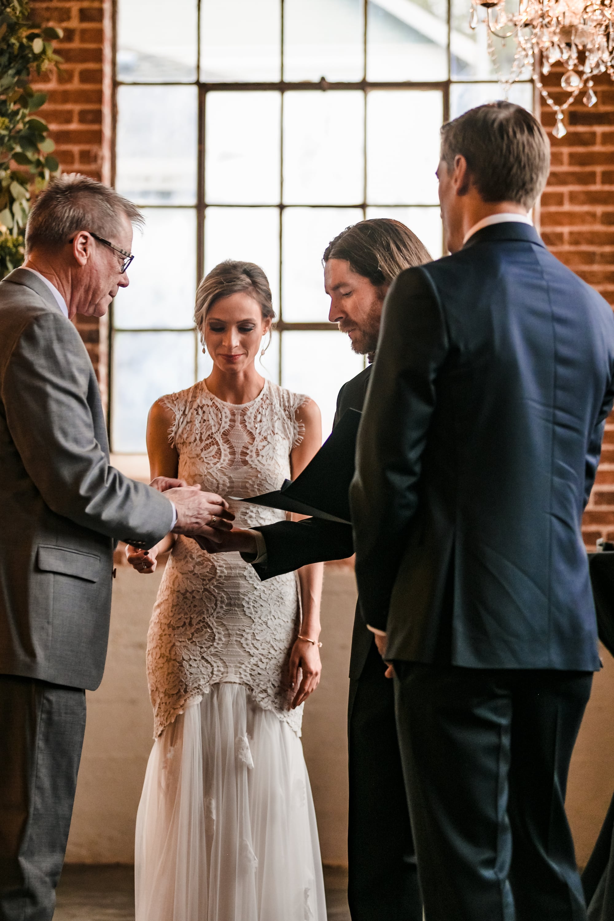 ring exchange, gathering the rings, dad giving the rings to officiant, dad holding rings, ceremony rings