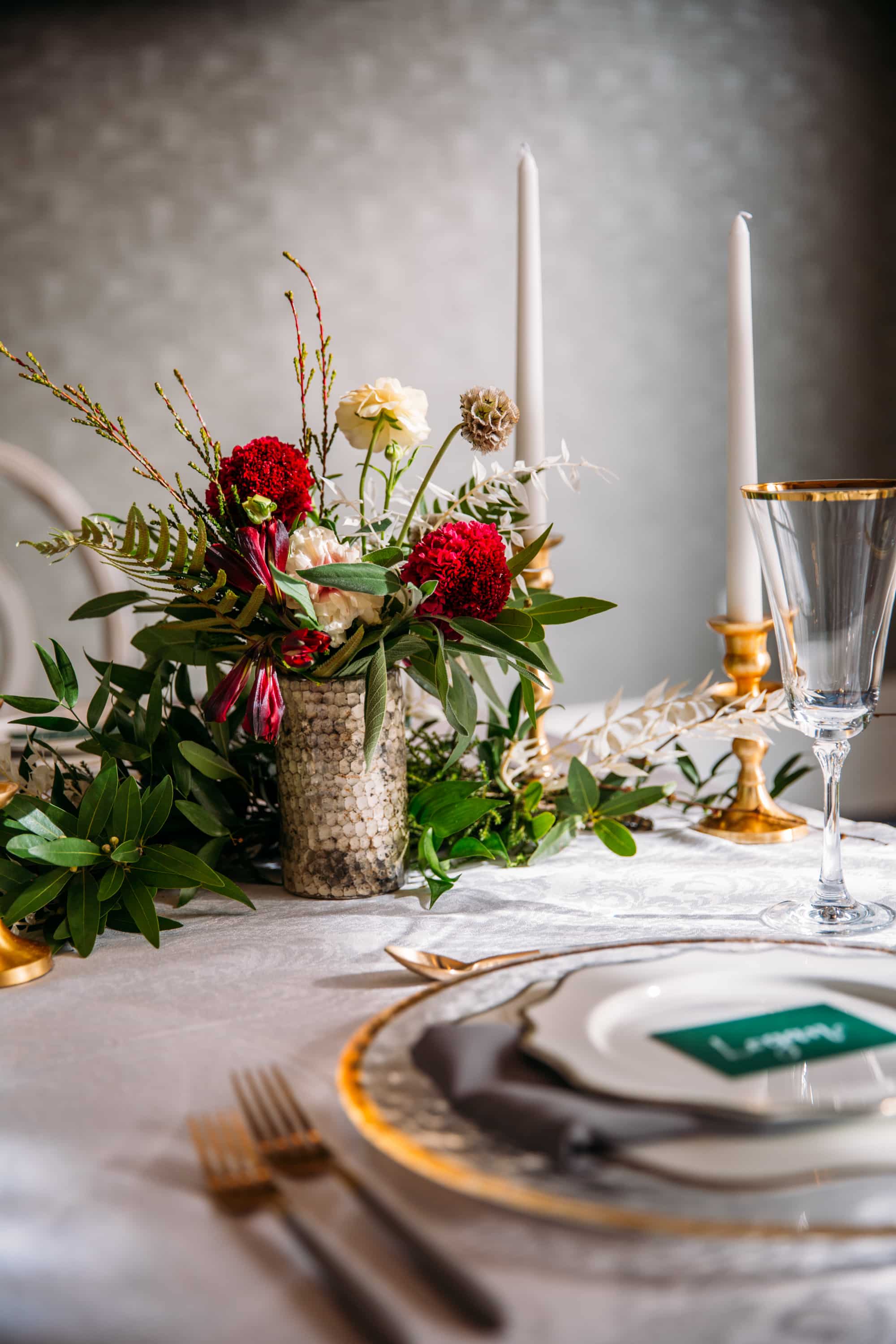 emerald wedding, wedding color inspiration, emerald and gold wedding, emerald and mustard wedding colors, gold silverware, elegant wedding tablescape, emerald wedding name tags, emerald name cards for table, white and gold candles, red and white wedding florals