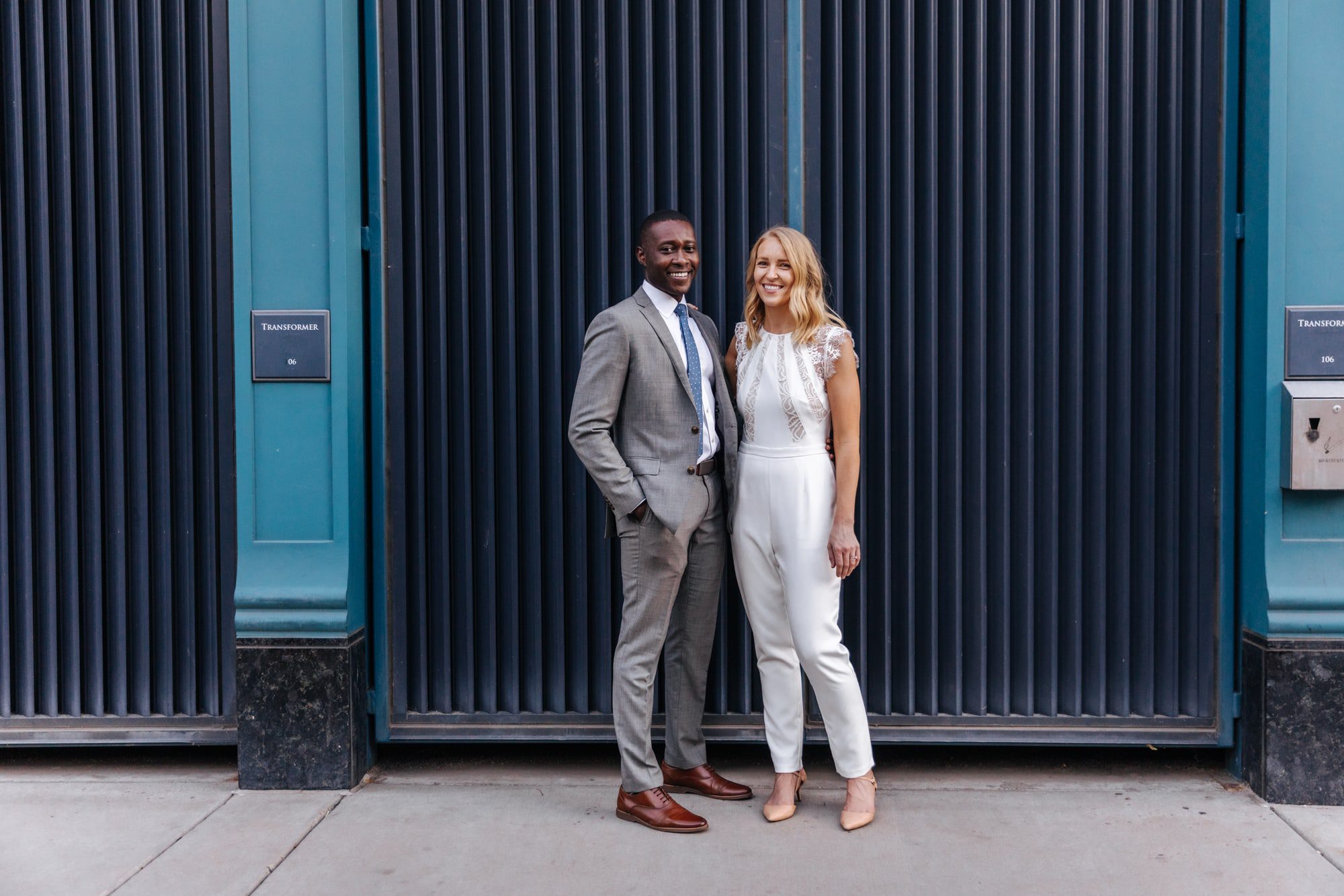 holding hands, formal outfit for elopement, outfit inspiration, bridal pantsuit, bridal jumpsuit, bride in pants, intimate wedding outfit, modern wedding outfits, courthouse wedding outfit, urban wedding photos, modern wedding photos, city wedding, colorado wedding photographer, colorado elopement, colorado wedding photographer