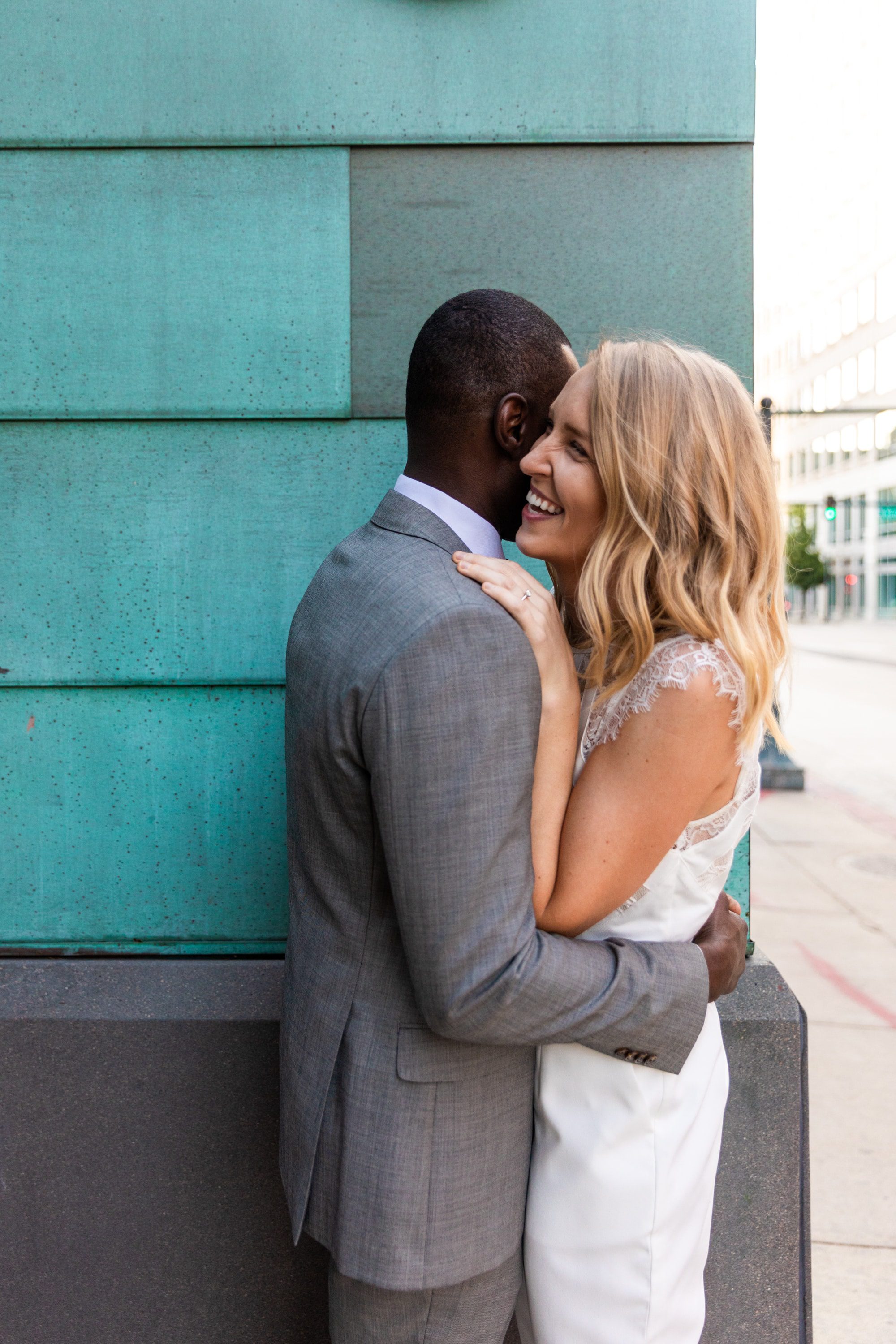 couple snuggling, couple photoshoot, colorado wedding photographer, downtown wedding photographer, urban elopement, formal outfit elopement