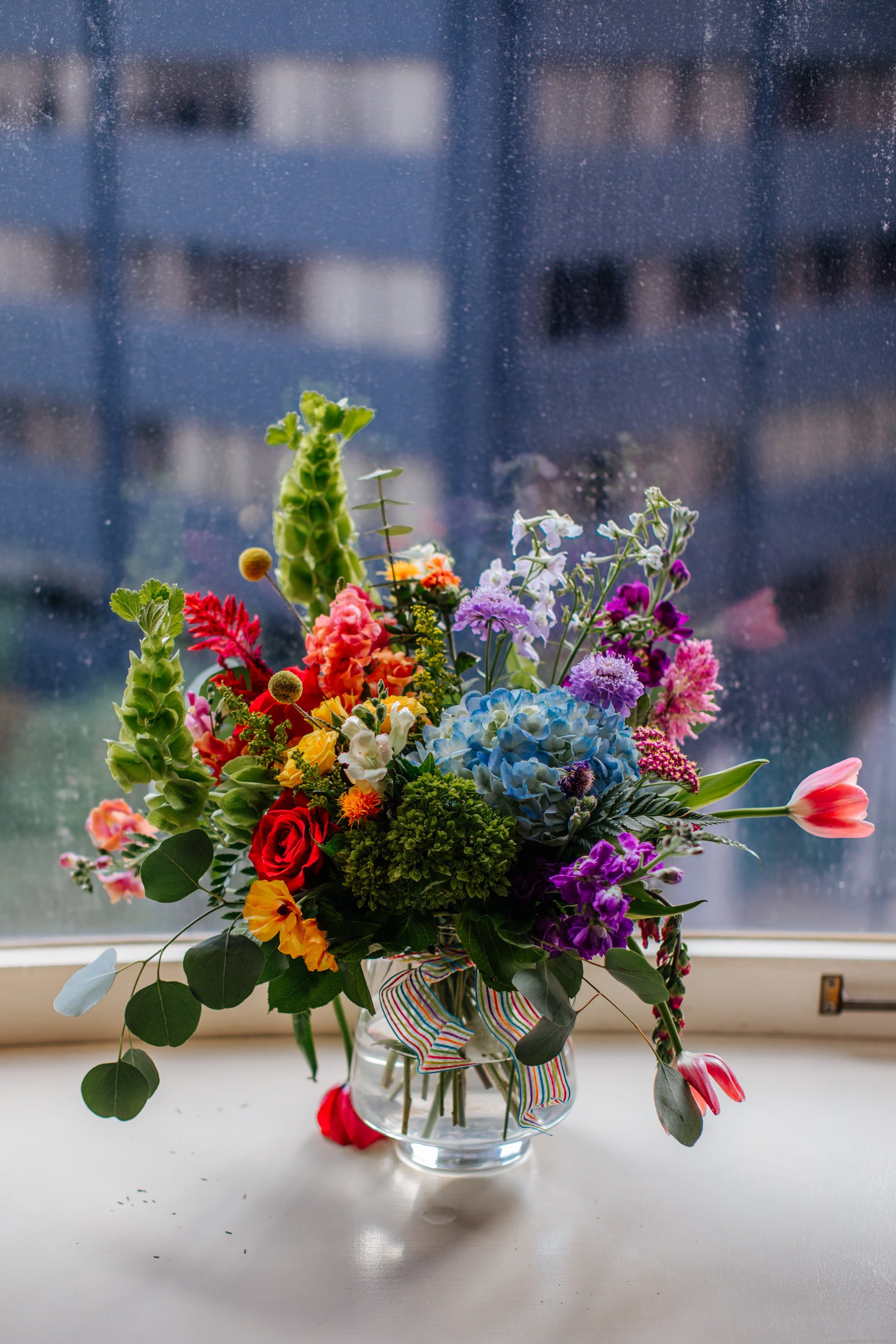 colorful wedding florals, colorful wedding bouquet, rainbow flowers, rainbow bouquet, rainbow floral arrangement