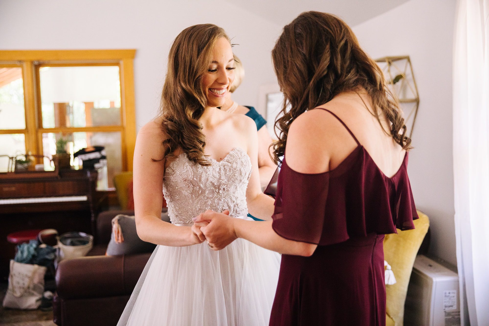 bride with sister, sister as maid of honor, bride getting ready with sister, bride getting ready