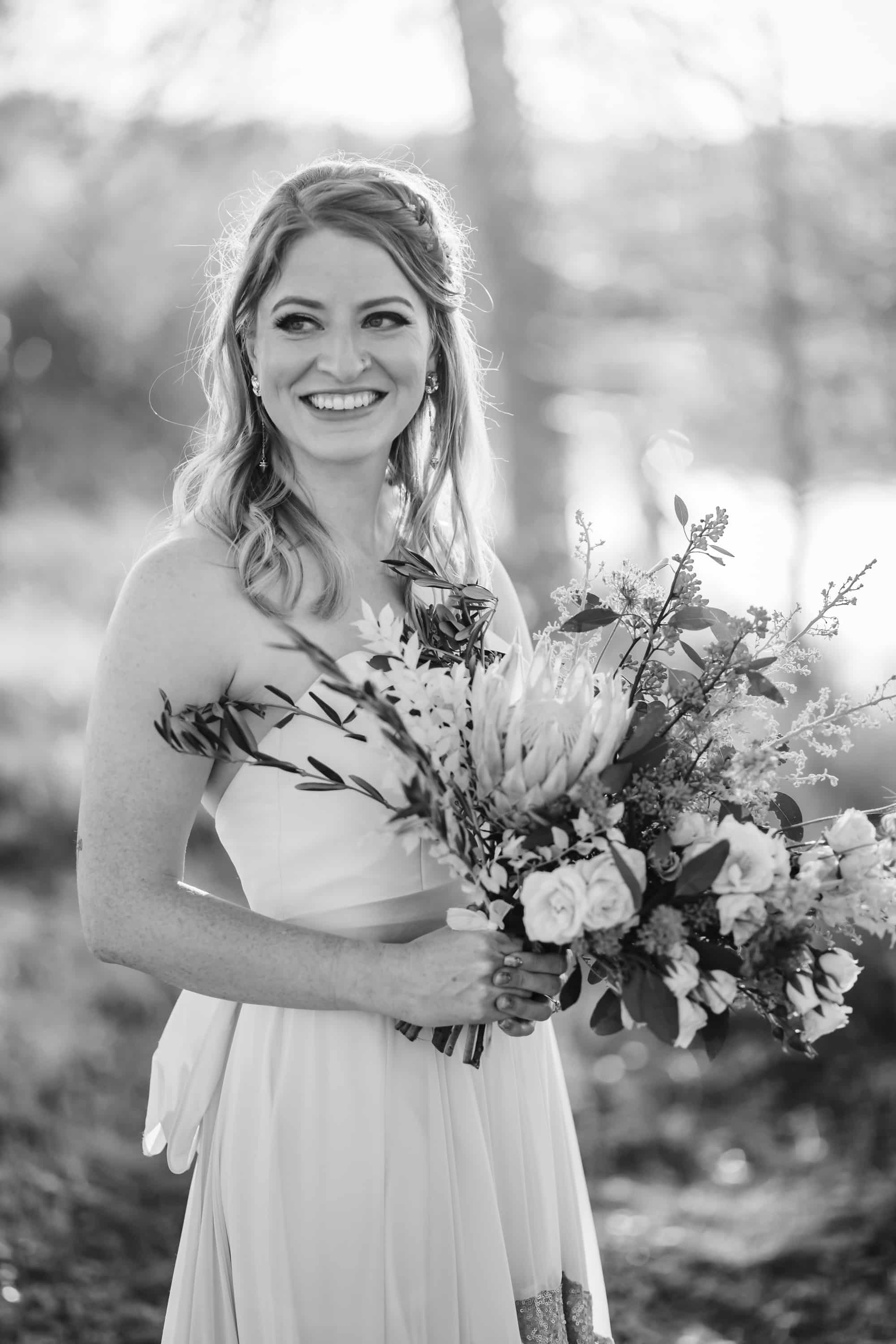 artichoke flower, large wedding flowers, large bridal bouquet, black and white bride, elegant bride, half up half down wedding hair, big wedding flowers