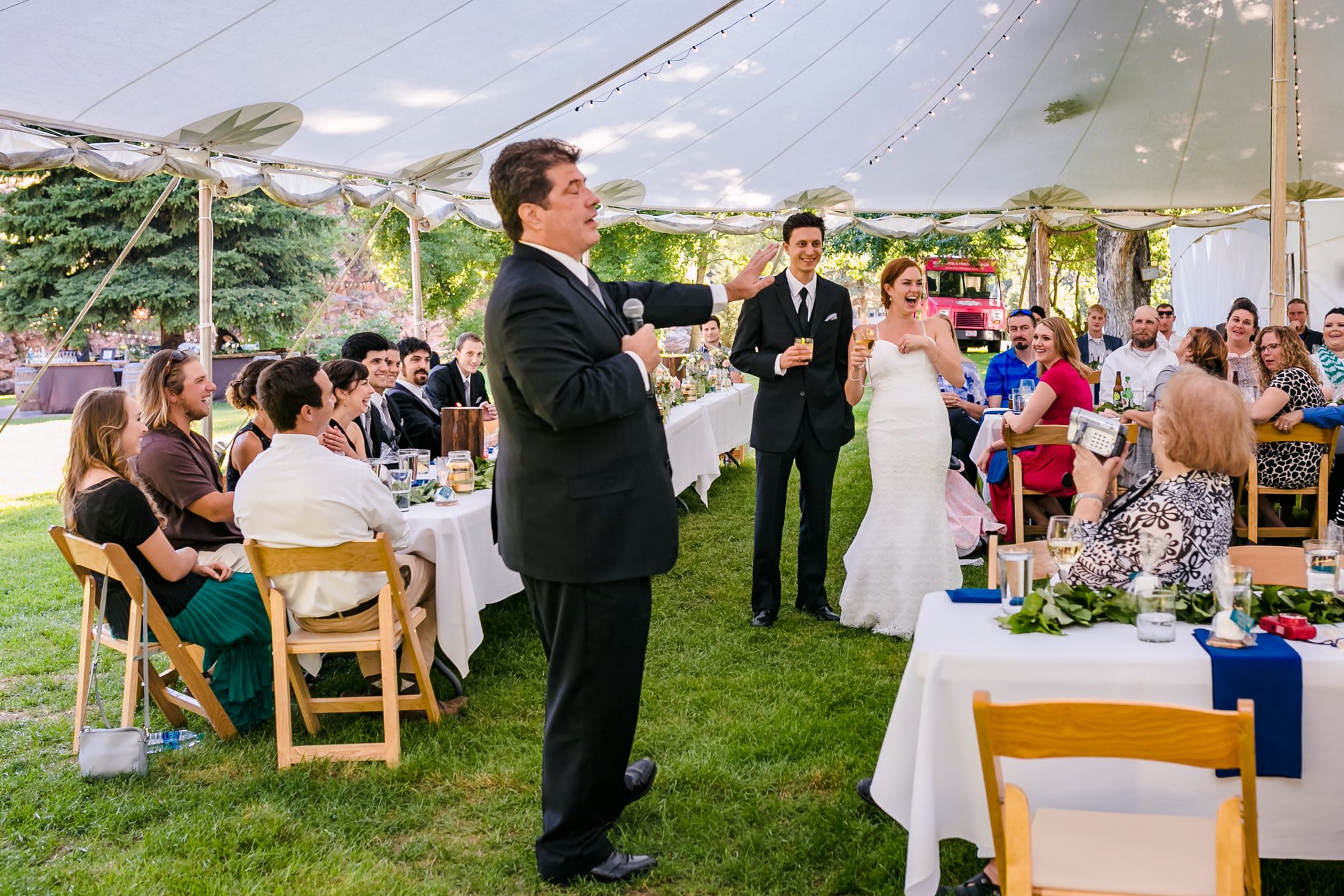 guest speeches, tent wedding, outside wedding, eating outdoors wedding, colorado summer wedding, colorado outdoor wedding venue