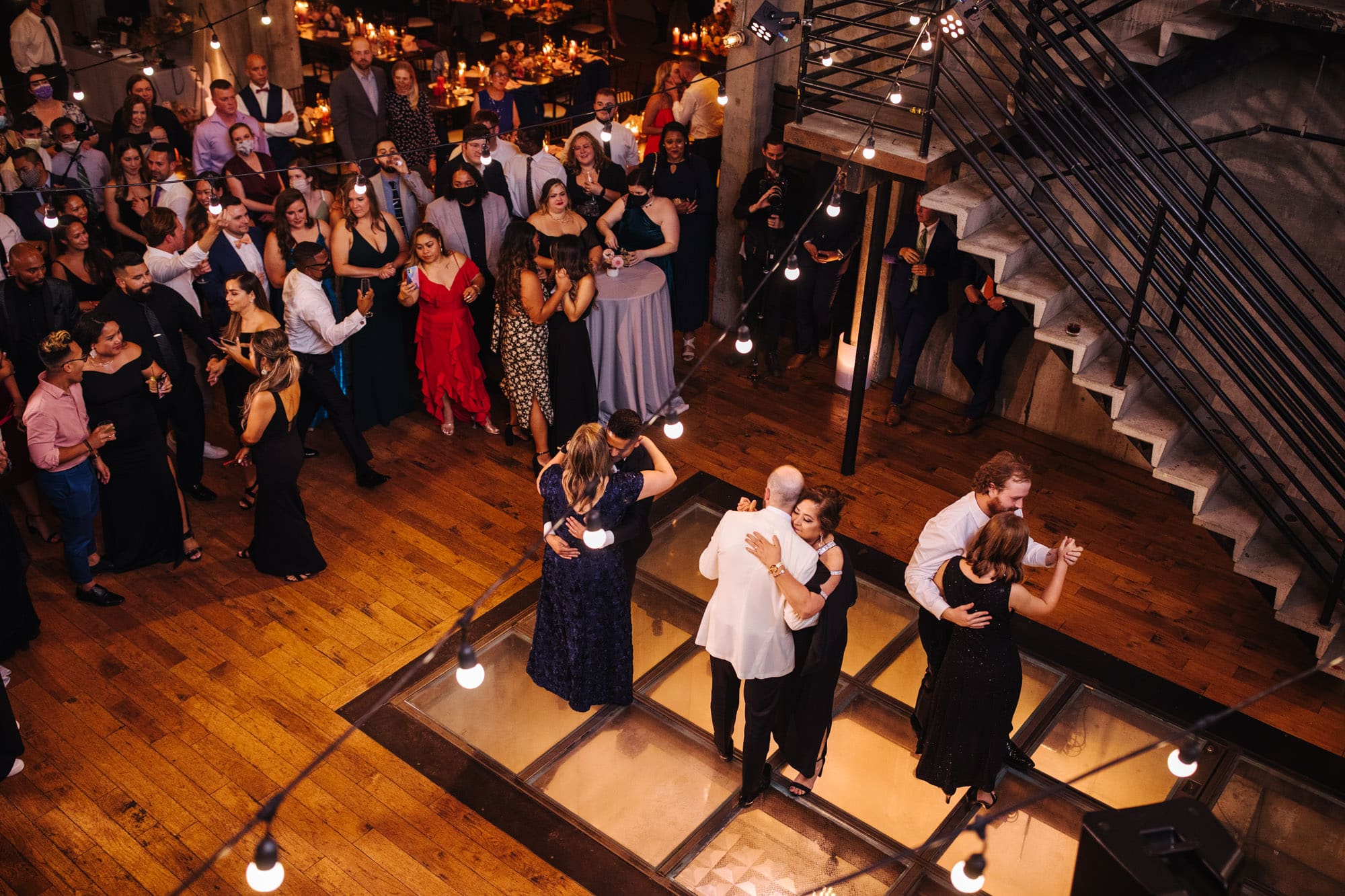lgbt first dances with moms, grooms first dance with moms, fremont foundry wedding, seattle industrial wedding venue