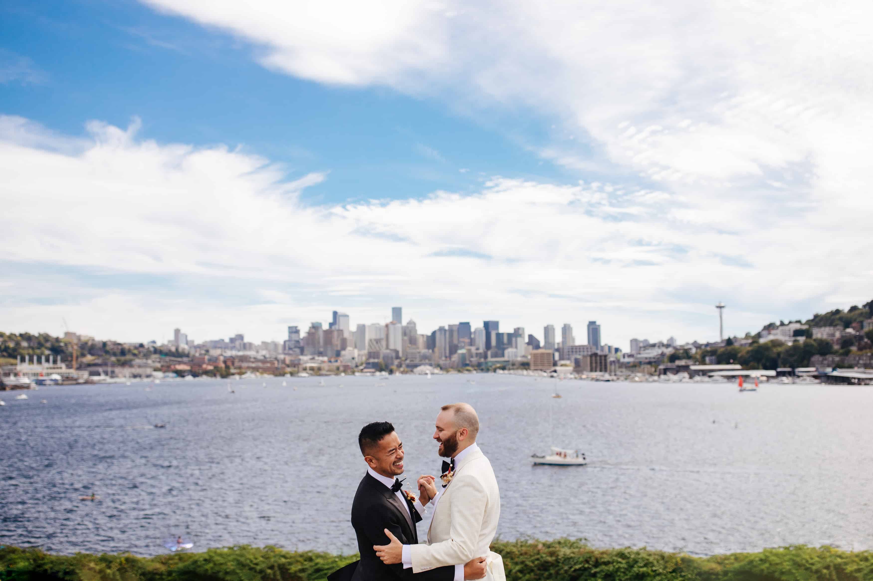 Seattle city wedding with two grooms dancing at Gas Works Park in downtown Seattle.