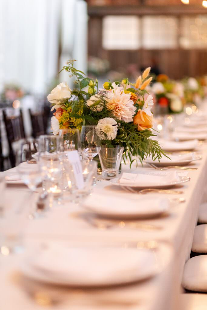 colorful wedding flowers, seattle elegant wedding flowers, seattle elegant colorful tablescape, sodo park wedding, sodo park seattle wedding, sodo park wedding reception, seattle wedding tablescape, white tablecloth with colorful bouquets, wedding table decor seattle