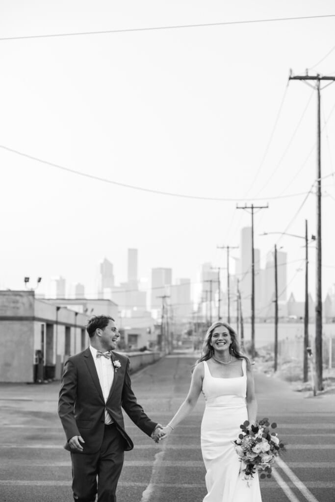 seattle skyline, seattle skyline wedding, seattle city wedding, golden hour photos, golden hour portraits, bride and groom during sunset, bride and groom sunset photos, sodo park seattle courtyard, sodo park seattle wedding portraits, herban feast seattle wedding venue, seattle urban wedding venue, golden sun portraits, black and white seattle wedding photos