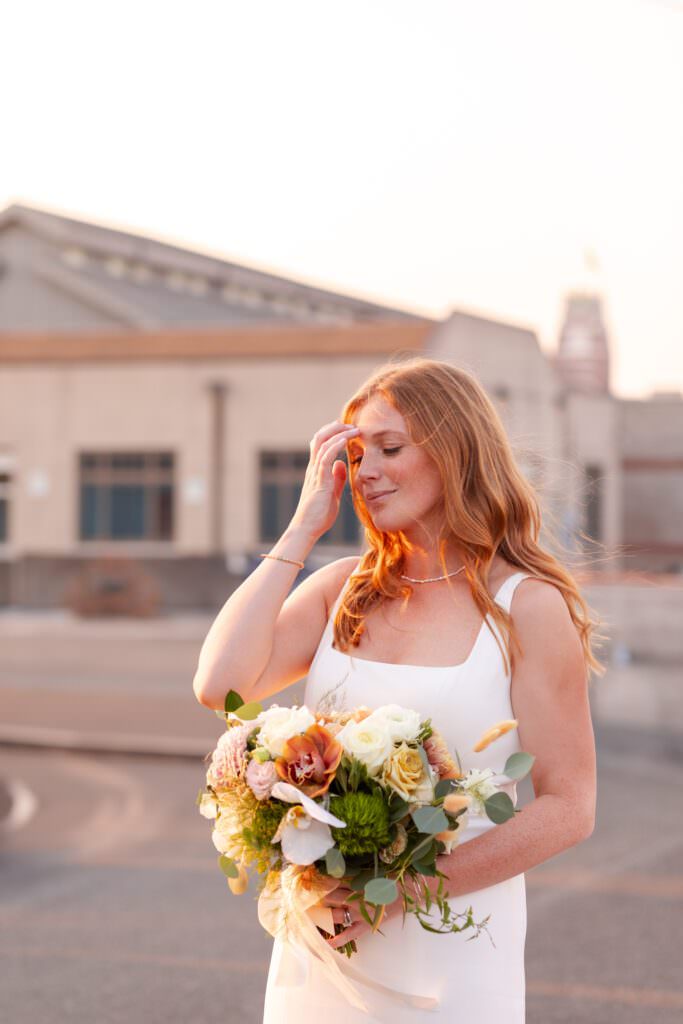 seattle city wedding, golden hour photos, golden hour portraits, bride and groom during sunset, bride and groom sunset photos, sodo park seattle courtyard, sodo park seattle wedding portraits, herban feast seattle wedding venue, seattle urban wedding venue, golden sun portraits, red headed bride, golden hour bridal photos