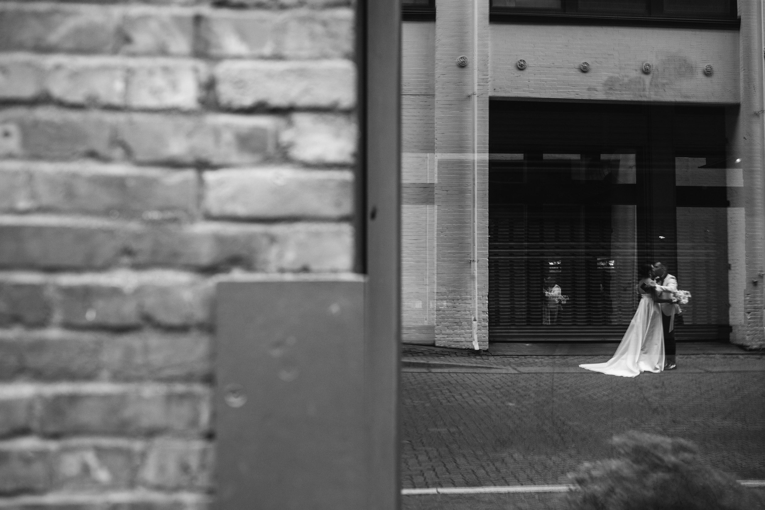 Bride and groom, during first look and private vows in elegant black tie, wedding outside of the Alexis Hotel Seattle
