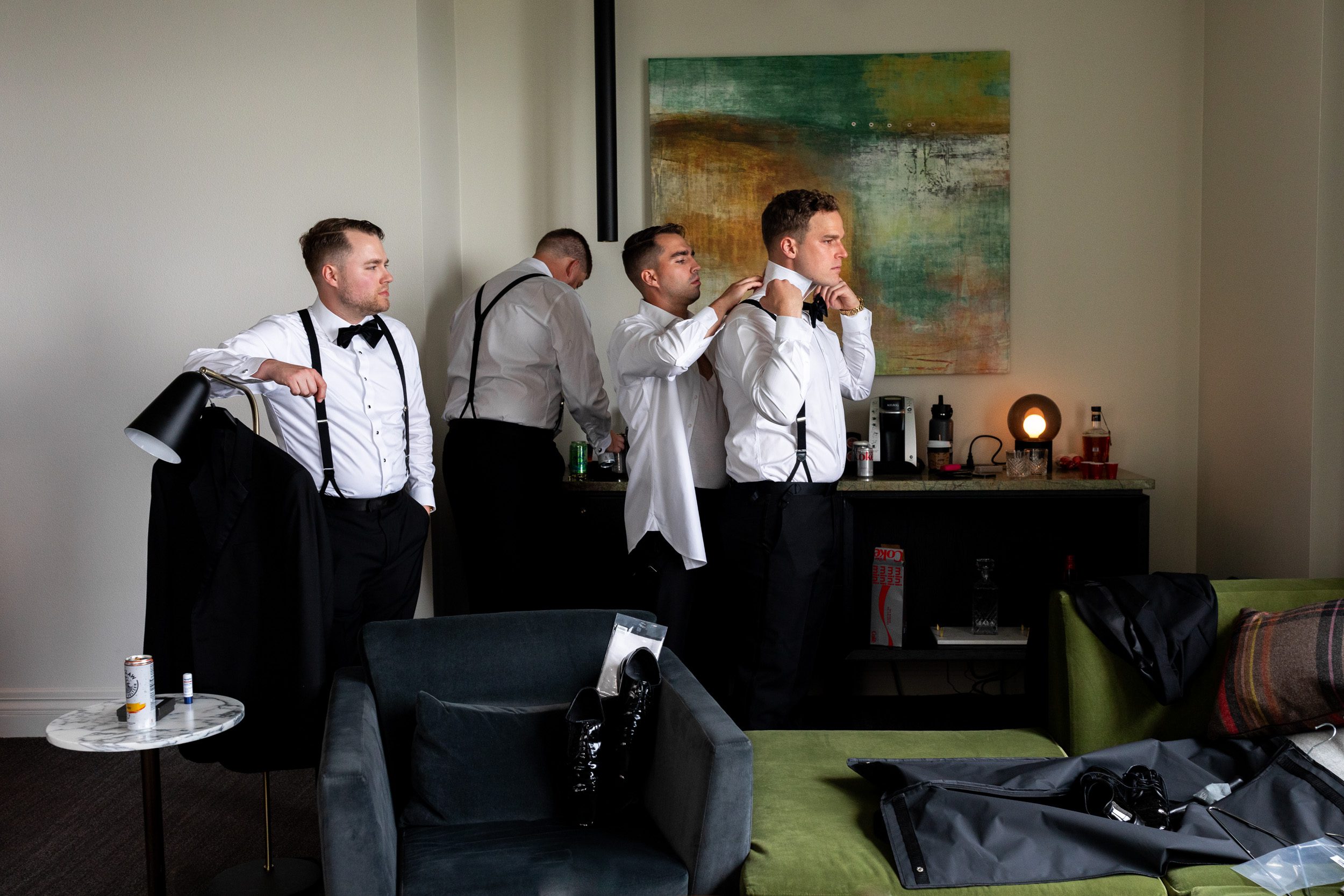 Groosmen getting ready before black tie wedding at The Alexis Hotel Seattle.