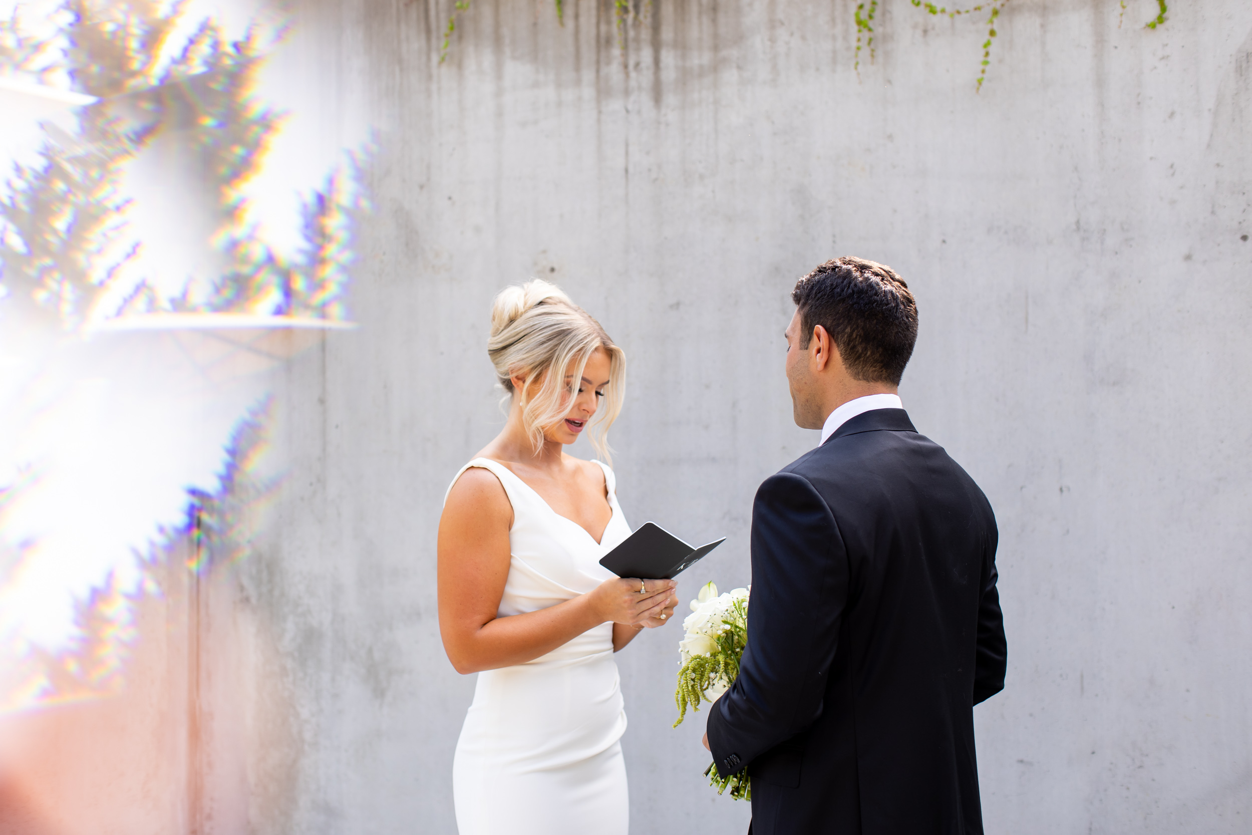 Bride reading her vows to her husband at their Novelty Hill Januik Wedding in Woodinville, Washington.