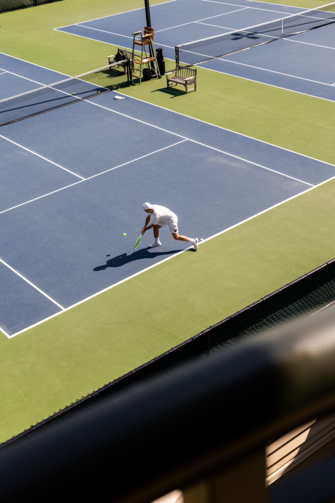Man playing tennis at Seattle wedding venue during getting ready