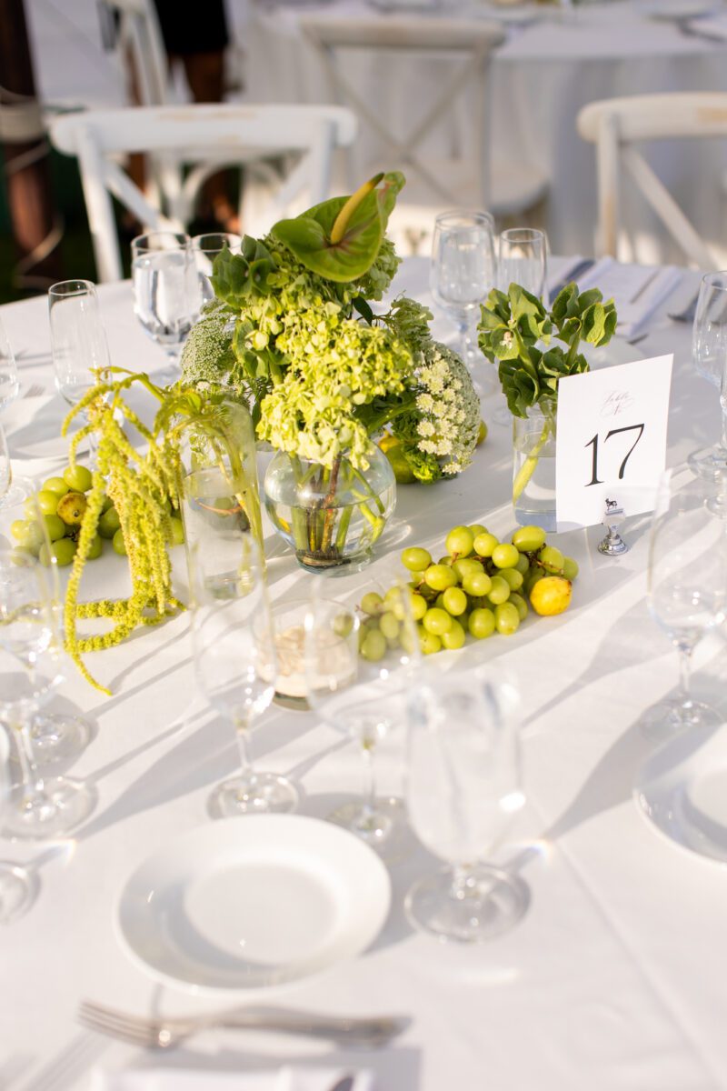 Seattle Tennis club outdoor tent wedding, grapes and green florals with white tablecloth