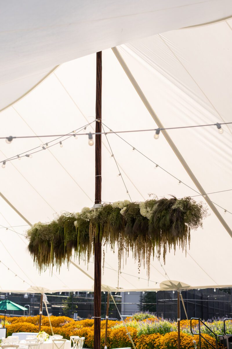 Seattle tent wedding reception with hanging florals