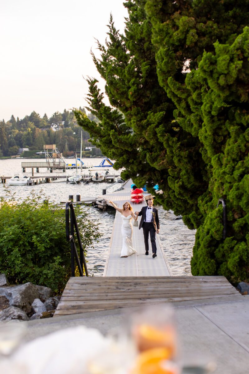 Bride and groom grand entrance off of boat into wedding reception