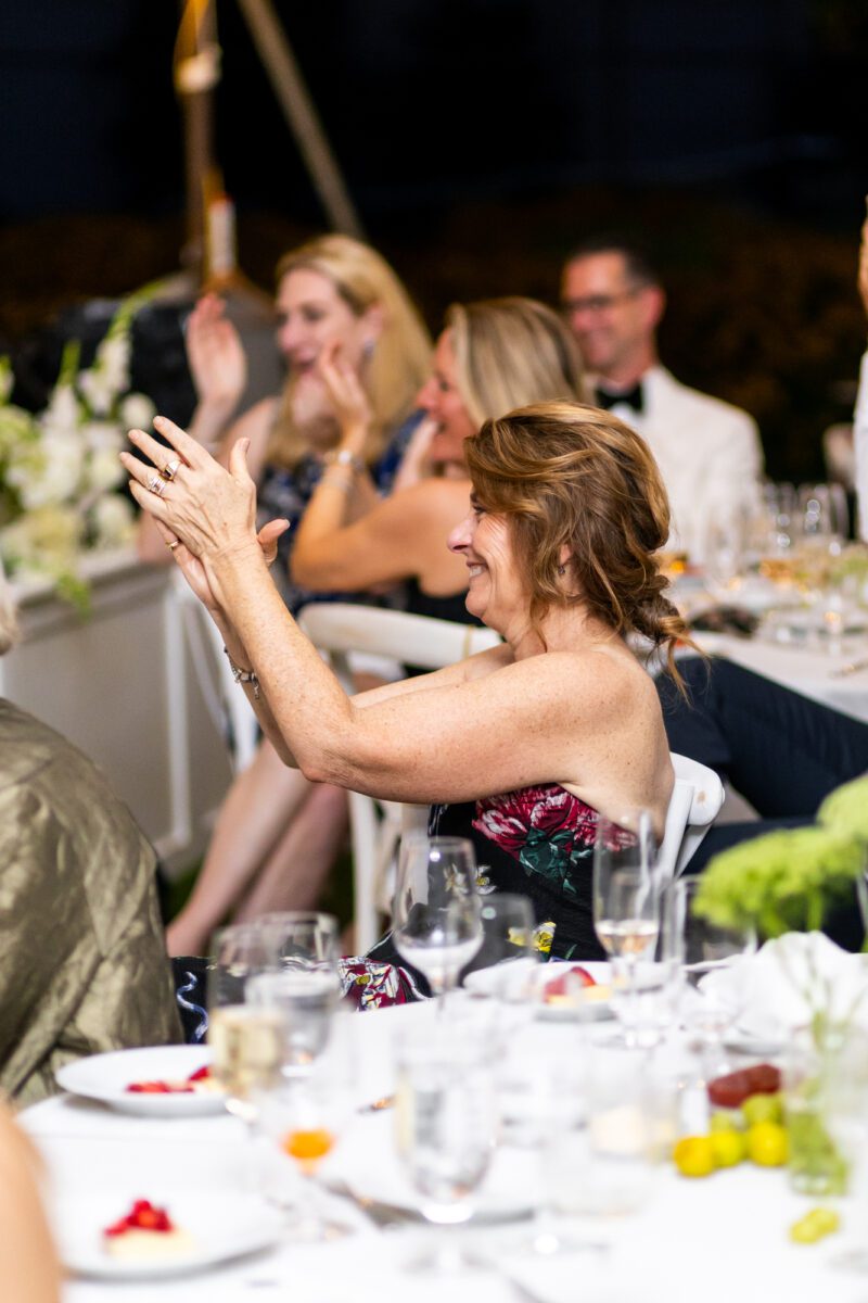 Guests cheering after wedding speeches