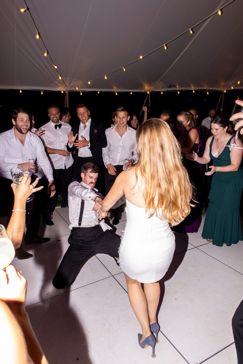 Bride and groom dancing during outdoor tent wedding at the Seattle Tennis Club