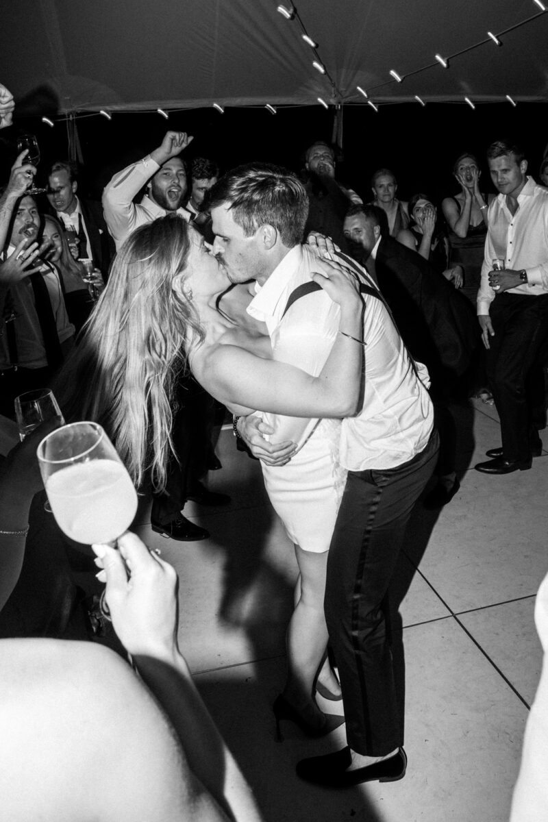 Bride and groom dancing during outdoor tent wedding at the Seattle Tennis Club