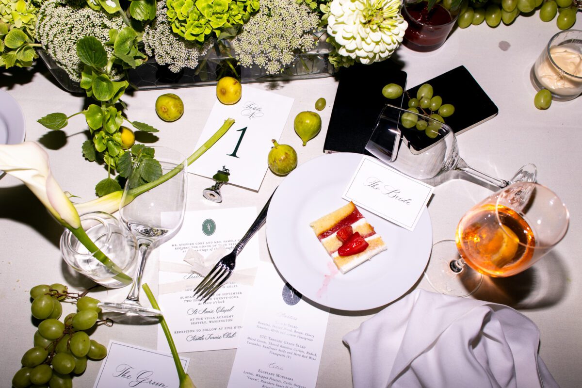 Late night flat lay, fun reception messy detail photo of cake and the wedding table