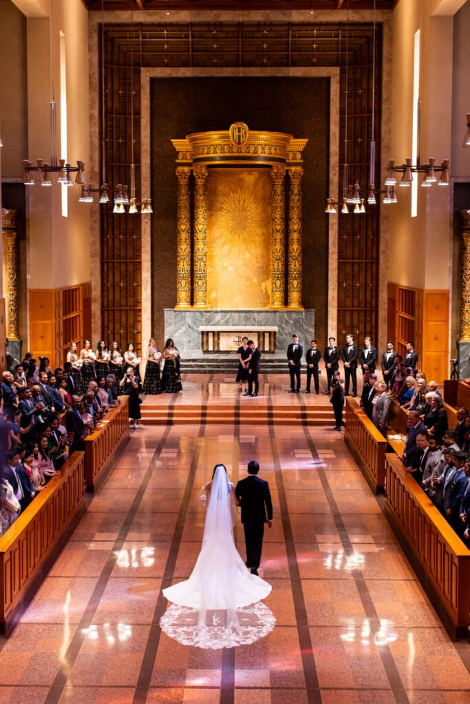 Bride walking down the aisle with dad during intimate church ceremony in Seattle at Bastyr Chapel