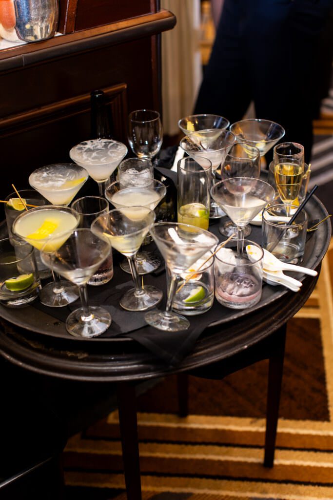 Photo of tray of drinks and napkins after cocktail hour during downtown seattle luxury wedding