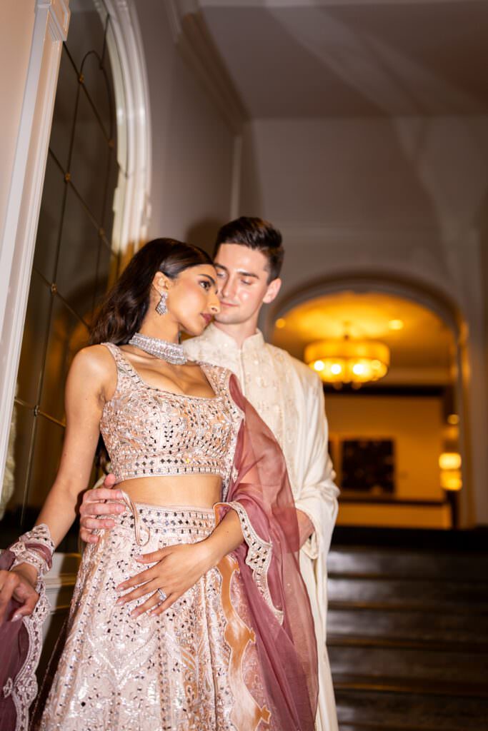 Bride and groom in traditional Indian dress during wedding reception at Fairmont Olympic Hotel Seattle
