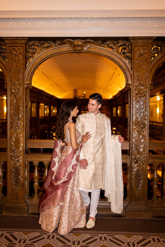 Bride and groom in traditional Indian dress during wedding reception at Fairmont Olympic Hotel Seattle