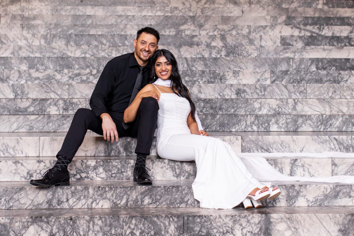 Bride and groom on the steps of the Olympia washington state capitol building for their seattle engagement photos
