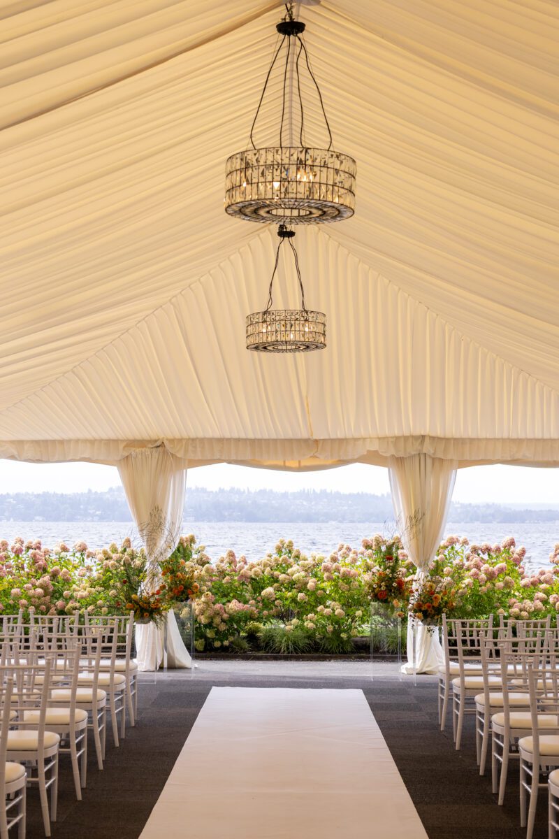 Woodmark hotel and still spa wedding ceremony set up with orange and yellow florals