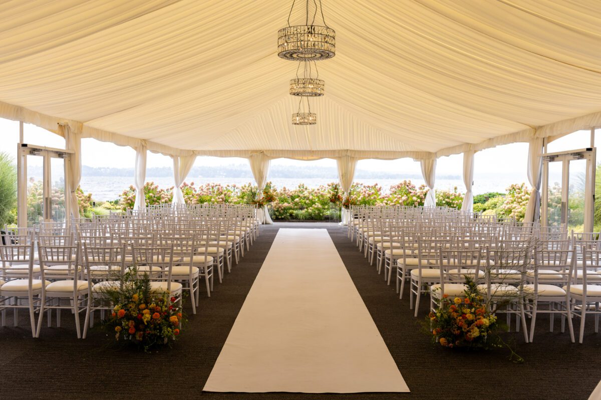Woodmark hotel and still spa wedding ceremony set up with orange and yellow florals