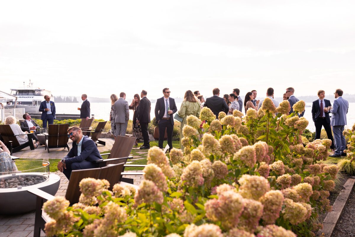 Guests mingling on the lawn during Woodmark hotel wedding