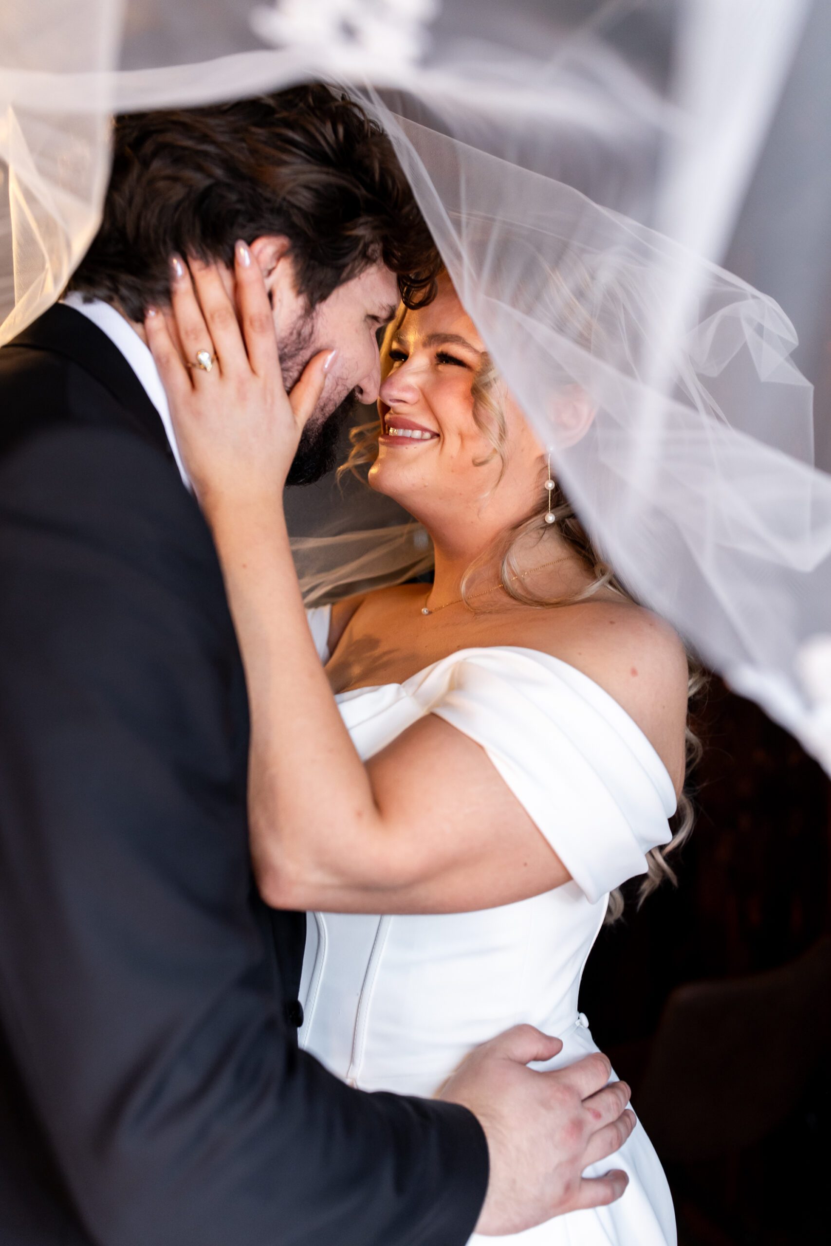 Bride and groom portraits upstairs in Bellingham for their Chuckanut Bay Distillery wedding, under veil photo