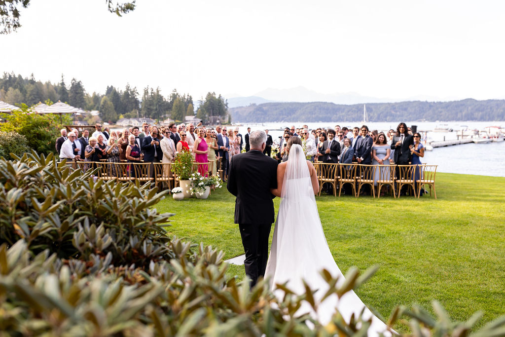bride and her dad walk down aisle at alderbrook resort