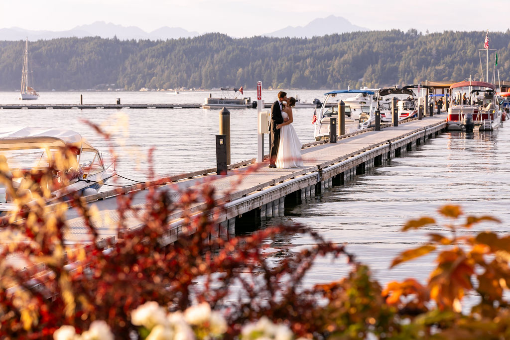 bride and groom on dock during cocktail hour